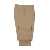 Manhattan pleated high-rise tapered trousers in beige cotton linen