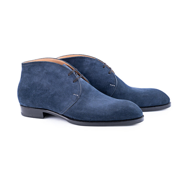 Chukka boots with two eyelets and curved topline in french blue suede leather