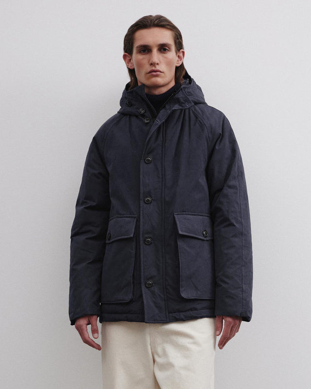 Down padded hooded jacket in a water repellent cotton blend fabric. Blue - Navy