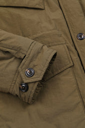 Padded field jacket crafted from a water-repellent nylon–cotton blend fabric. Green - Ficus
