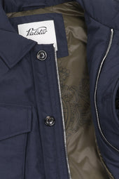 Padded field jacket crafted from a water-repellent nylon–cotton blend fabric. Blue - Navy