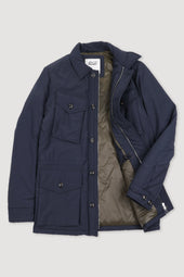 Padded field jacket crafted from a water-repellent nylon–cotton blend fabric. Blue - Navy