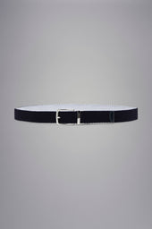 Leather trimmed woven reversible elastic belt