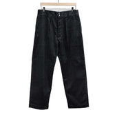 Pleated wide slacks in black cotton corduroy