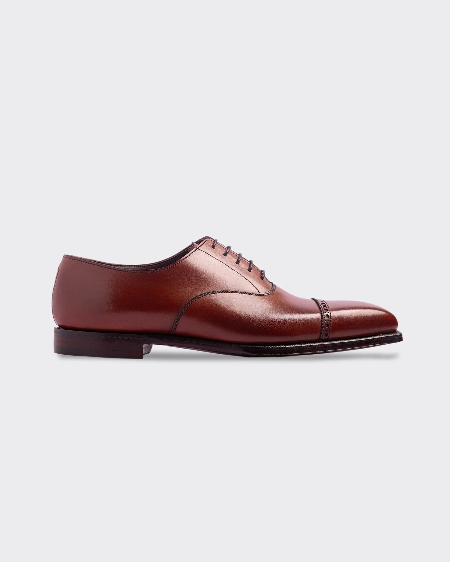 The ‘Charles’ Oxford is handcrafted in England from supple burnished chestnut brown calf leather. — George Cleverley
