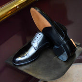 Pearce en cuir noir (Archives)