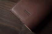 Take Care Passport Case . Deep Brown