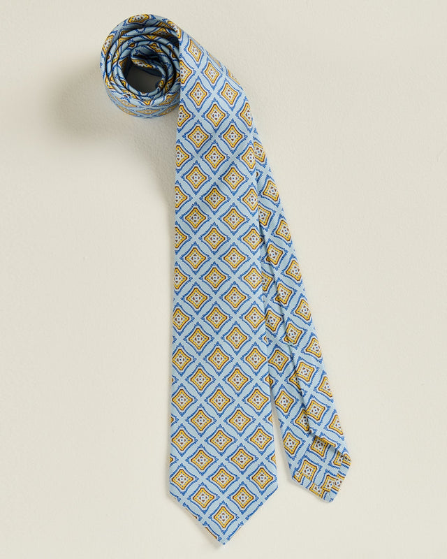 LIGHT‑BLUE SILK TIE WITH GEOMETRIC PATTERN