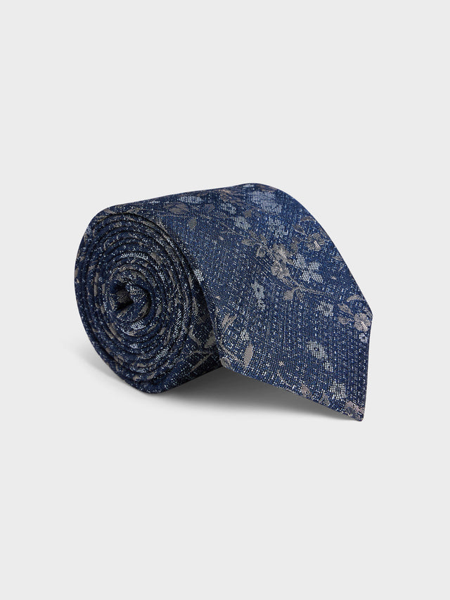 Cravate large en coton et soie bleu azur à motif fleuri