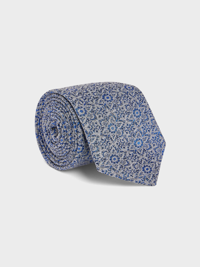 Cravate large en soie et coton bleu azur à motif fleuri