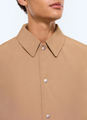 Quilted coat in water-repellent fabric
