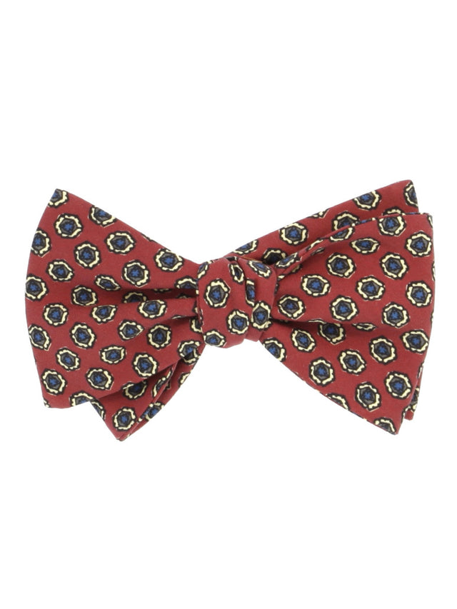 Red pre-tied silk bow tie with disc pattern